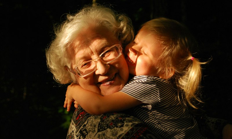 Grandmother hugging her granddaughter